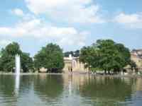 City park with water, fountain, and trees