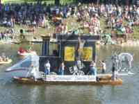 Boat showing ICE train front, old-style locomotive, and a goat