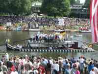 Long, low, black-and-white striped boat