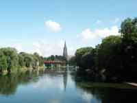 The Münster with a red train in front of it