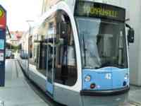 Blue and white and black streetcar