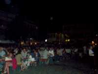 Hundreds of people at picnic tables