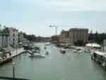 Grand Canal. A vaporetto and several docks are visible on the right.