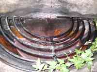 Wine-filled basin with metal grate