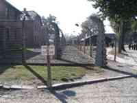 Barbed-wire fences and warning sign