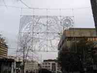 Metalwork art hanging over shopping area