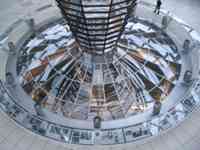 Mirrored column above windows offering view into parliament chamber