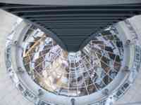 Steep view down into parliament chamber, through windows