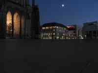 Bottom of church and large plaza at night