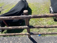 Wood-covered metal fence